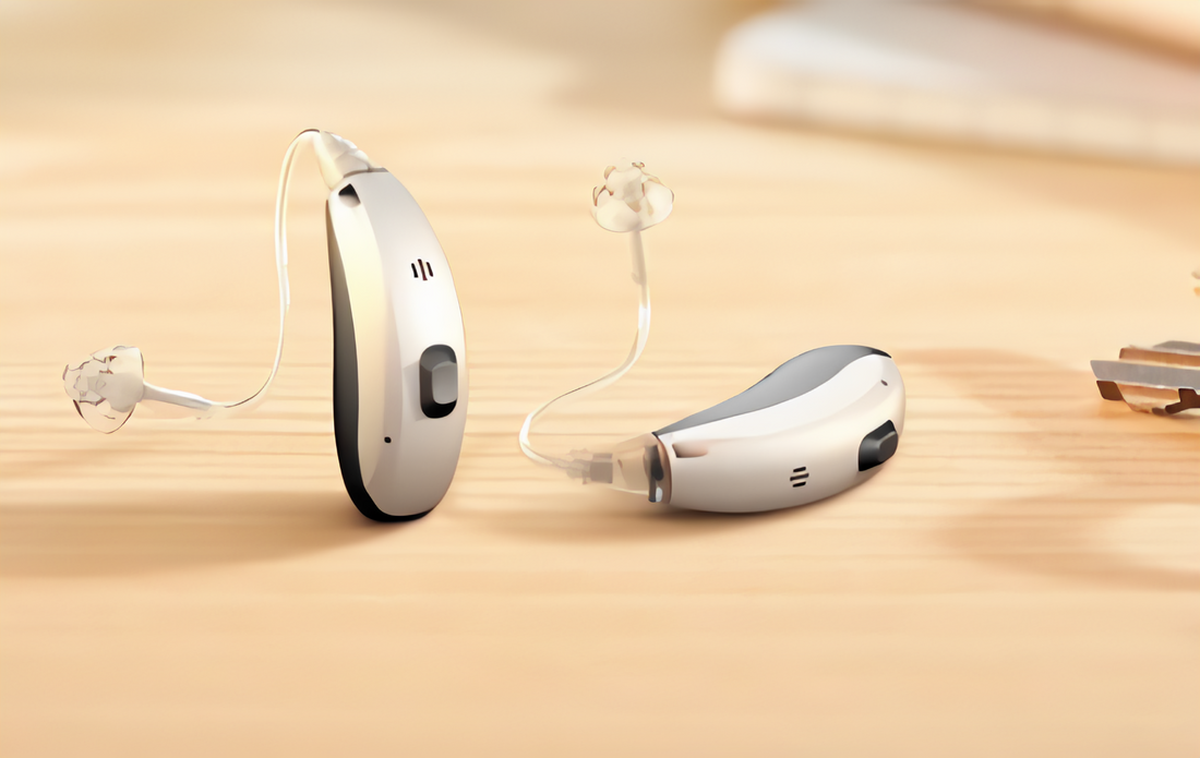 A pair of hearing aids placed on a wooden surface