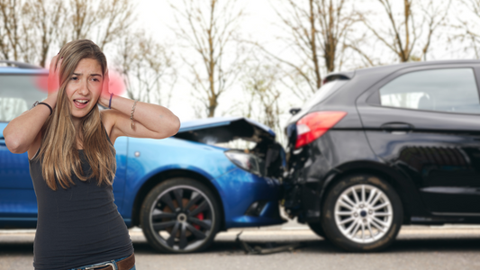 Image of a car accident scene with a person holding their ears due to tinnitus.