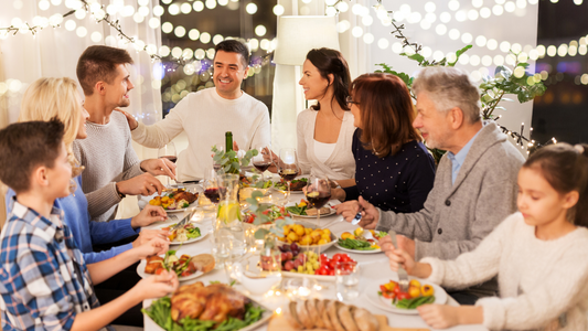 Family gathering around the dinner table, engaged in conversation.