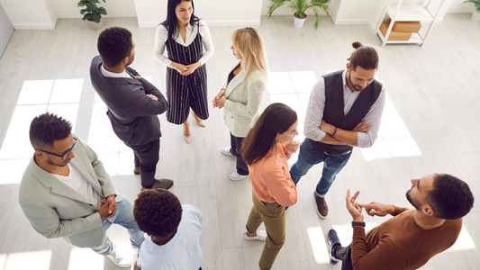 Illustration depicting a diverse group of people in conversation, highlighting the challenges of hearing loss in social settings.