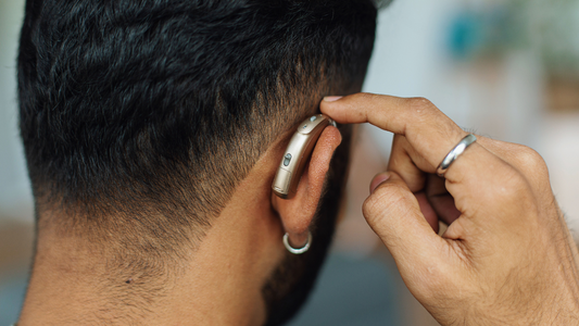 Image of a person wearing a hearing aid.