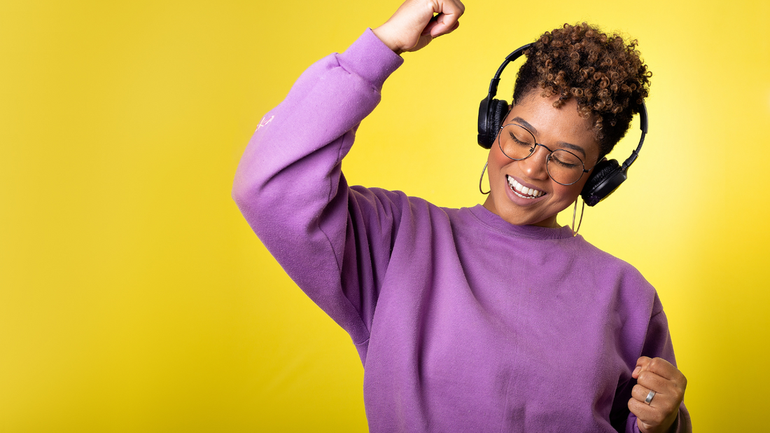 A person smiles while listening to music.