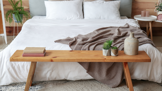 A serene bedroom with soft lighting and comfortable bedding, inviting relaxation and sleep.