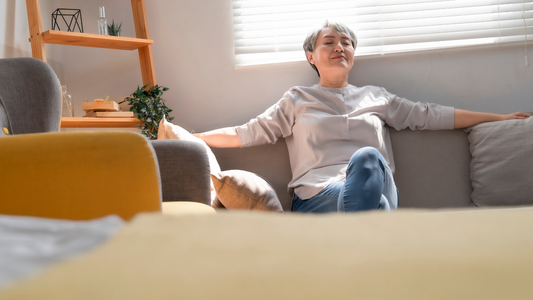 Image of a person sitting peacefully in a quiet room, symbolizing relief from tinnitus.