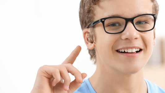 Person wearing hearing aids and glasses comfortably.